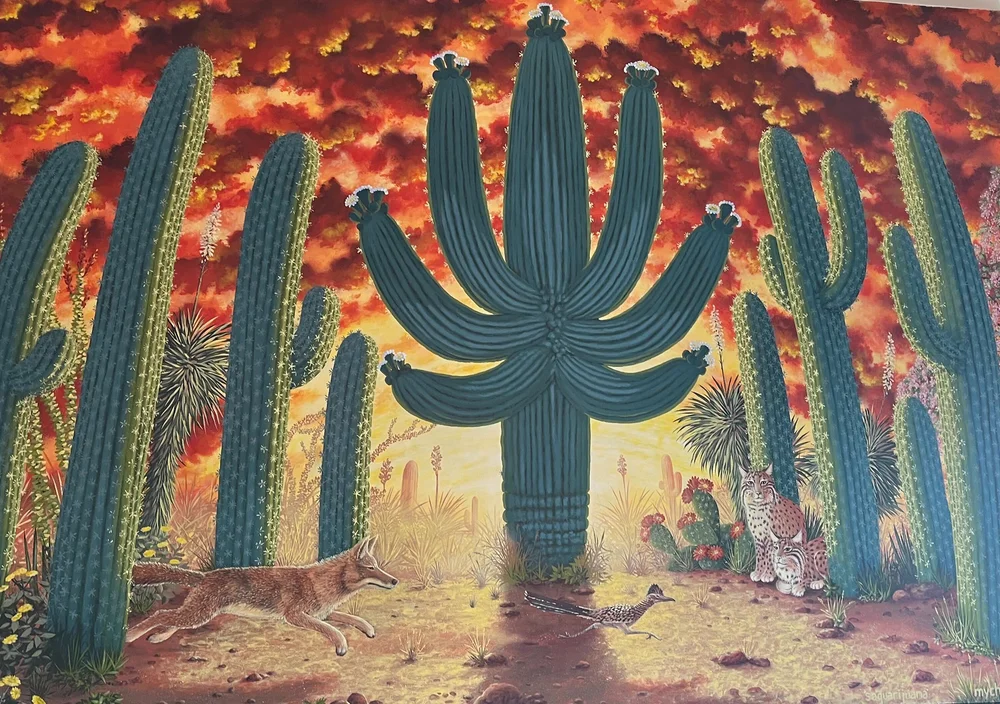 A cactus mural with a weed leaf shaped cactus in the center at Tucson 6th