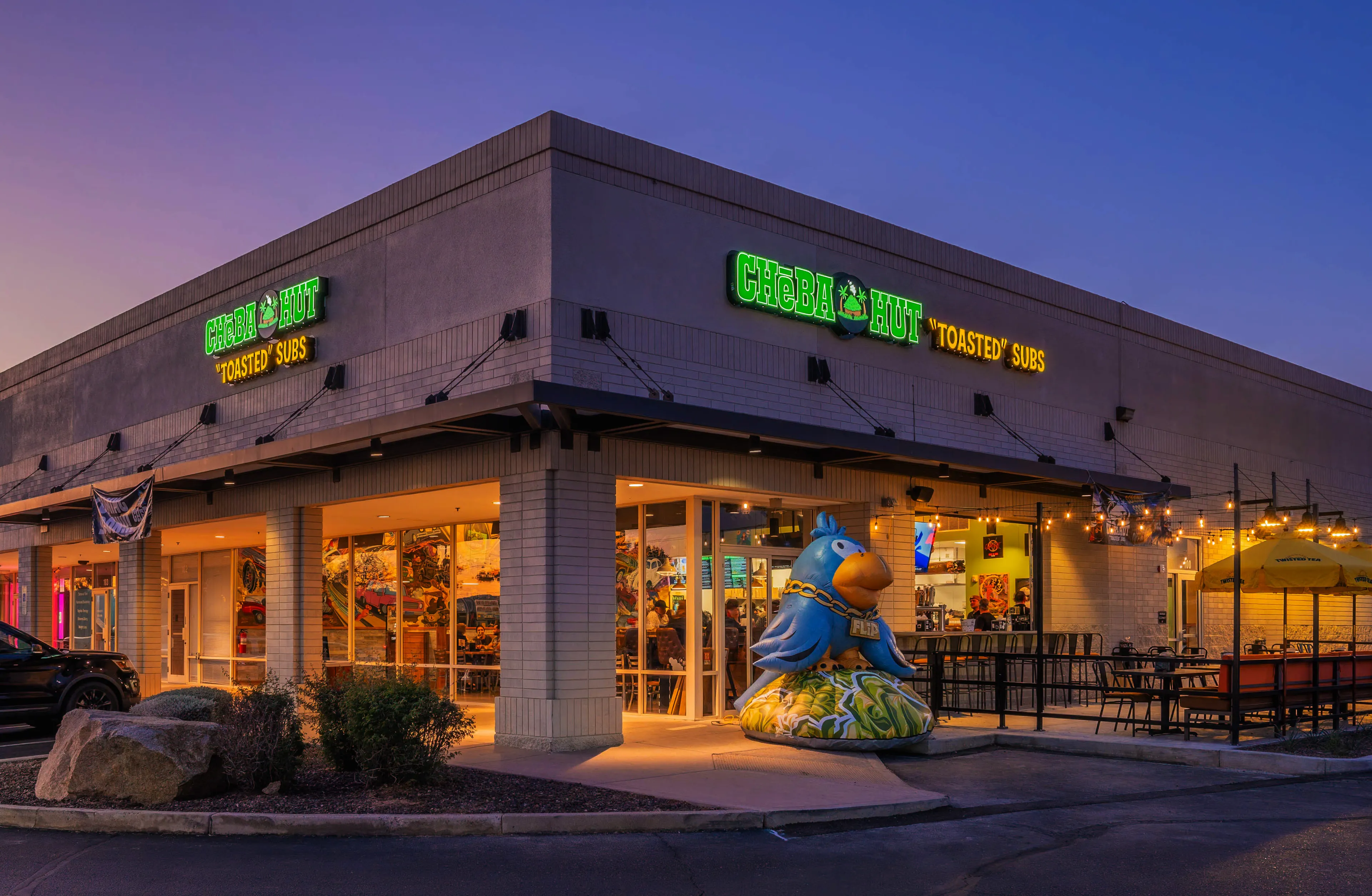 Cheba Hut shop exterior at sunset