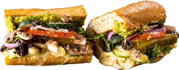 Mowie Wowie Tropical Veggie toasted sub with hummus, guacamole, honey mustard, green bell peppers, and pineapple.