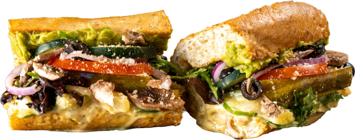 Mowie Wowie Tropical Veggie toasted sub with hummus, guacamole, honey mustard, green bell peppers, and pineapple.