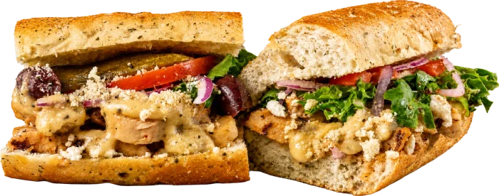 Apollo 13 greek chicken / HUMMUS toasted sub with grilled chicken breast, garlic butter, kalamata olives, banana peppers, and feta.